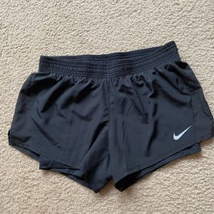 Nike black, size medium, lined shorts. Never worn